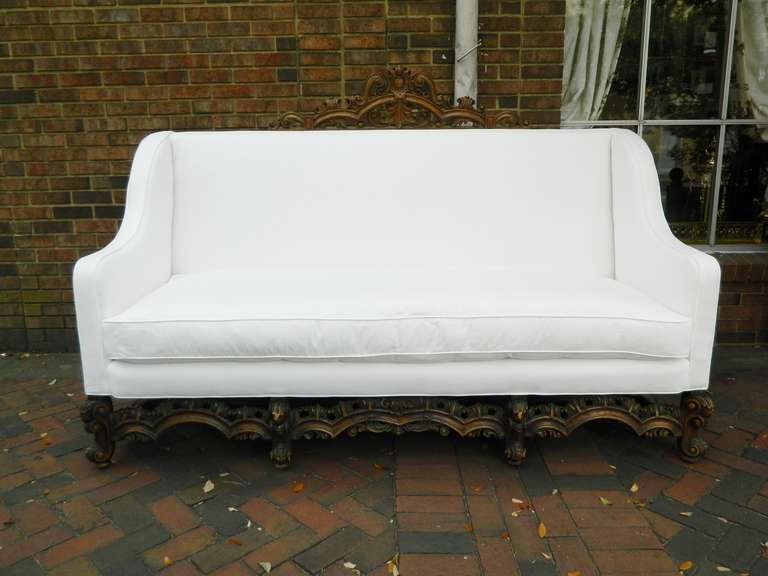 19th Century Italian Renaissance Revival Canape or Sofa, having a pierce carved arched crest over the upholstered back, arms and seat above the pierce carved frieze raised on scrolling legs.  Top Wood Piece is removable