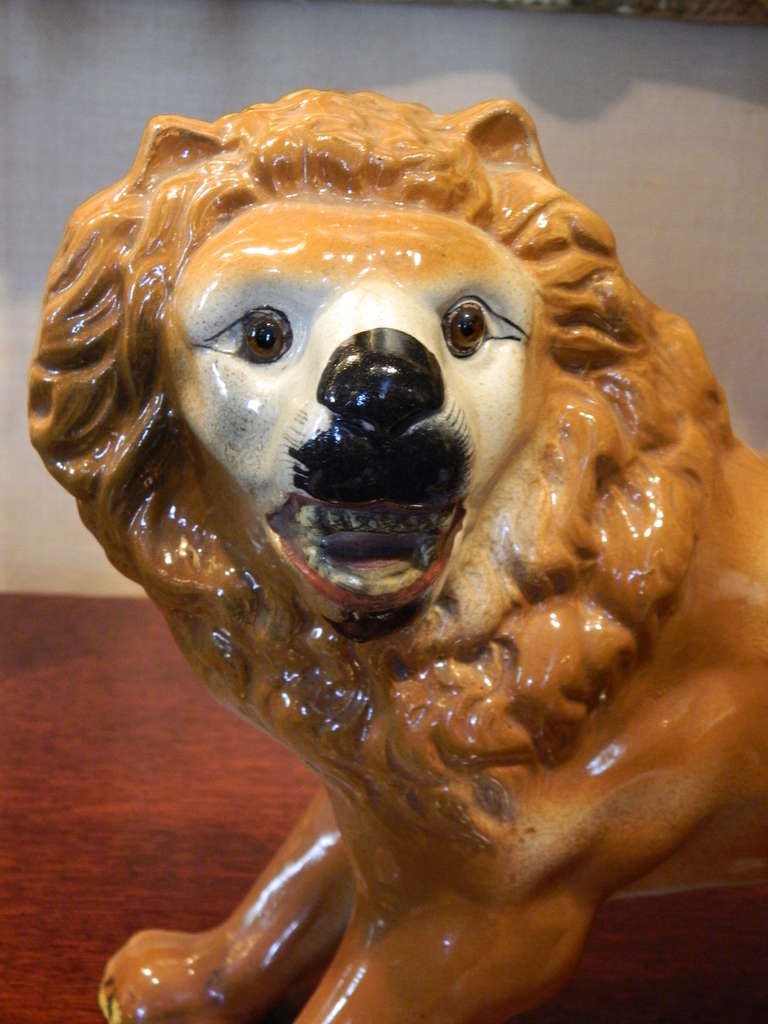 Porcelain Pair of Late 19th Century Staffordshire Opposing Lions with Glass Eyes