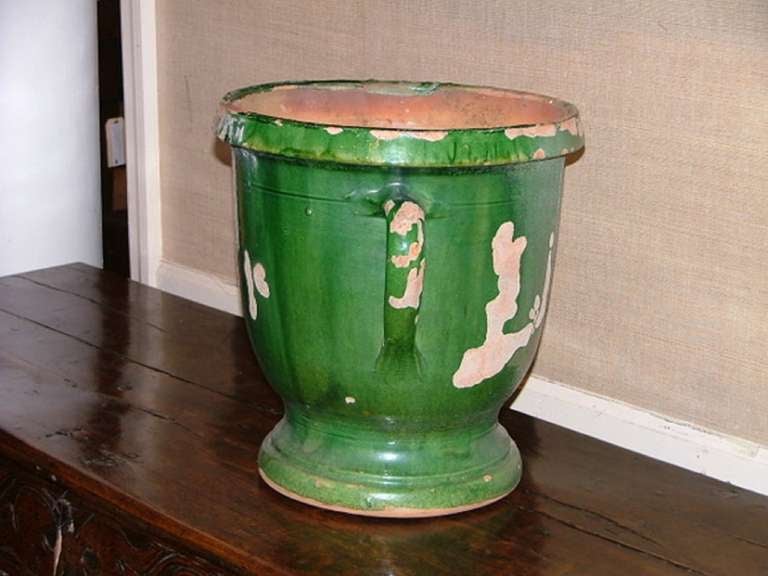 Late 19th century French Provincial Anduze glazed terracotta green urn with two handles.