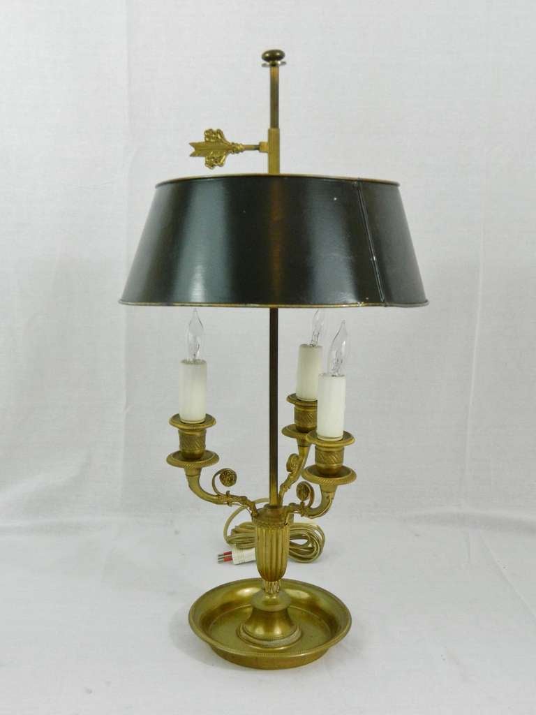 19th Century Louis XVI Style Three light Gilt Bronze Bouillotte Lamp with a Black Metal Tin Shade.  Lamp has been rewired to American standards and fitted with bees wax sleeves