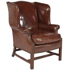 Circa 1920 English Leather Wing Chair with Down Cushion