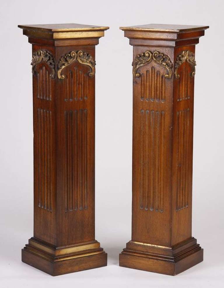 Late 19th Century Pair of George III Style Carved and Parcel Gilt Square Fluted Mahogany Pedestals