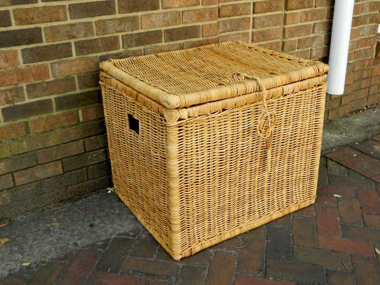 Pair of early 20th century French large wicker storage baskets. Will sell individually.