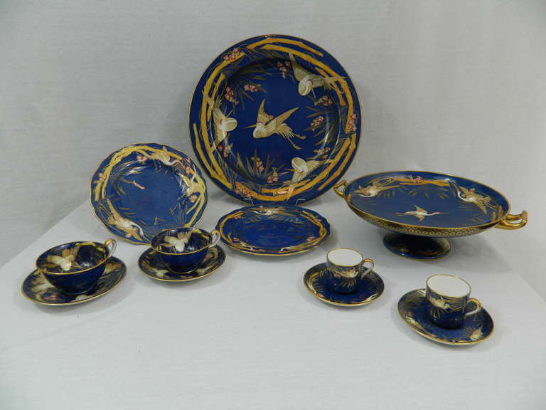 19th Century Spode Copeland England Sixty Piece Dessert Set.  Each piece has a cobalt blue and gilt background and decorated with exotic birds and flowers.  Set is composed by 12 dessert plates, 12 demitasse cups and saucers, 11 coffee cups and
