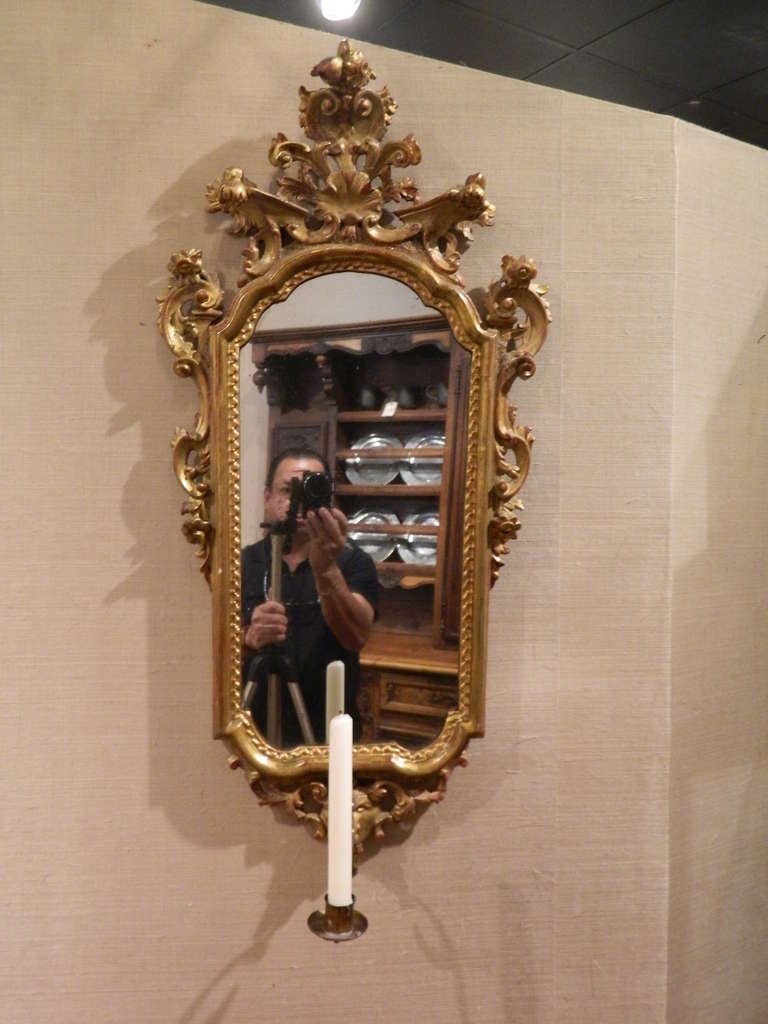 19th century French gold gilt mirror with a candle sconce.