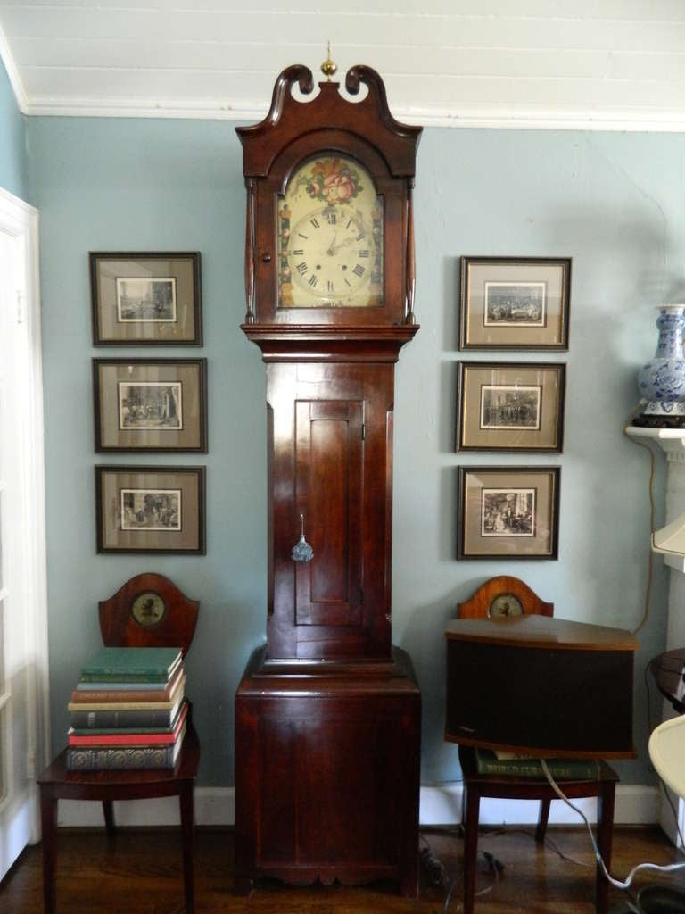 Early 19th Century English Mahogany Tall Case Clock with Case in Original Condition and in Working Order.  Case was made by Bob Lorenz (1805-1878) and the face was painted by Balthasar Dotten in 1847