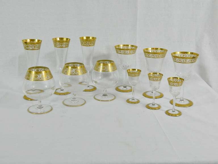 Early 20th Century Saint Louis French Cut Crystal Stemware - Thistle Décor with Open Band Foot and Rim.  10 Champagne flutes, 10 cordials, 10 goblets, and 10 brandy. Total 40 pieces in Original Condition, No chips or cracks.  Original boxes