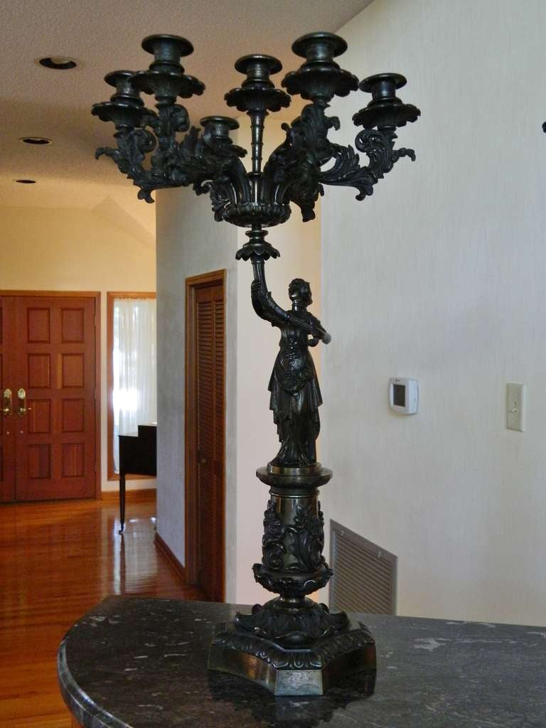 19th Century Pair of Bronze Six Candle Candelabra with winged and draped female figures,  standing on bases, holding Six candle arms.  Base is 6.5