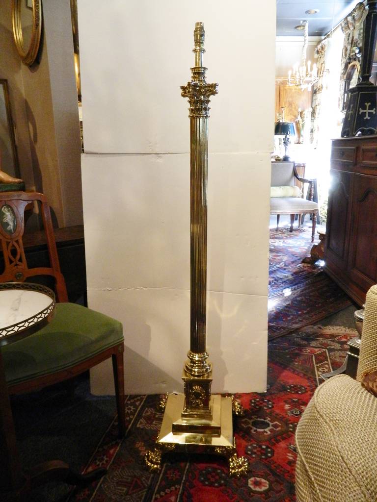 19th Century French Polished Brass Telescopic Floor Lamp with Corinthian Reeded Column, Wreath motiff, and terminating on Paw Feet.  Height goes from 54