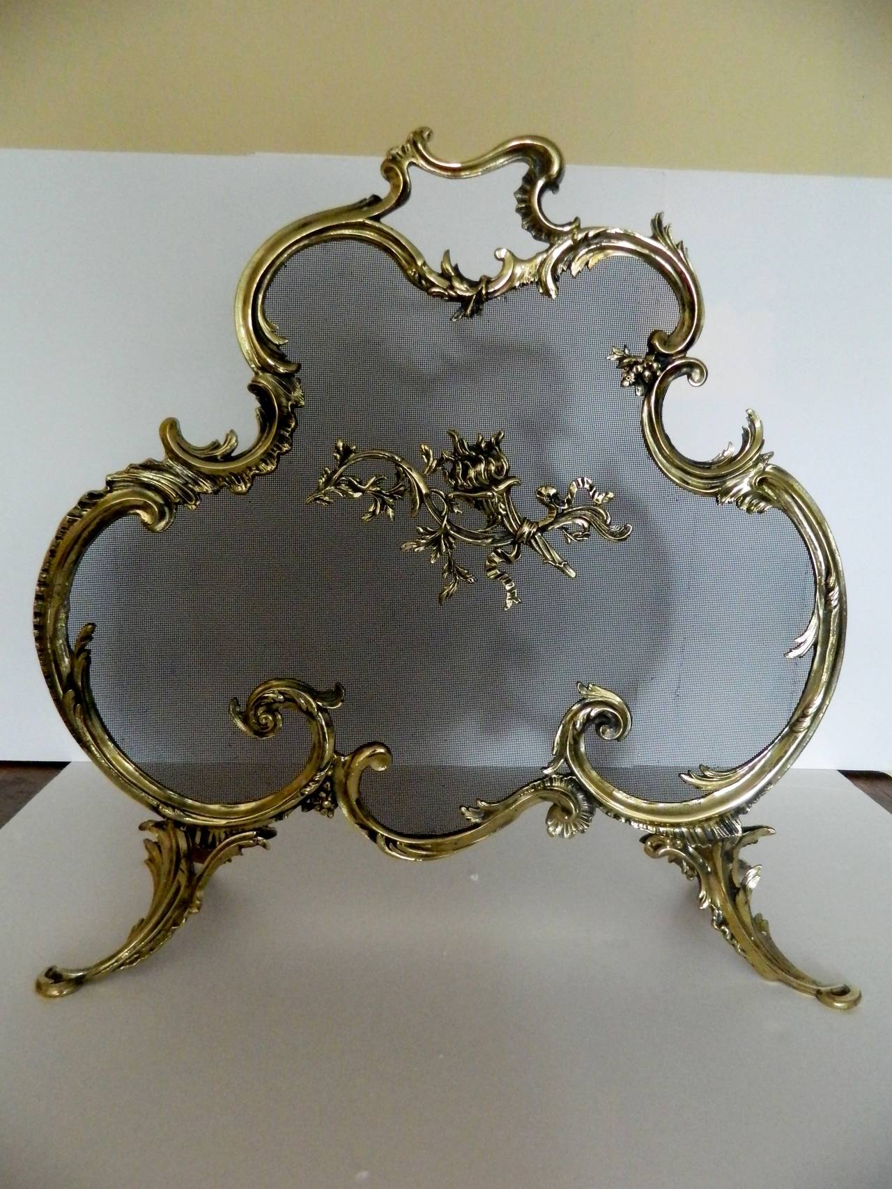 19th Century French Polished Brass Fire Screen Adorned with a Fire Cheriot in the Center.  Professionally cleaned and polished