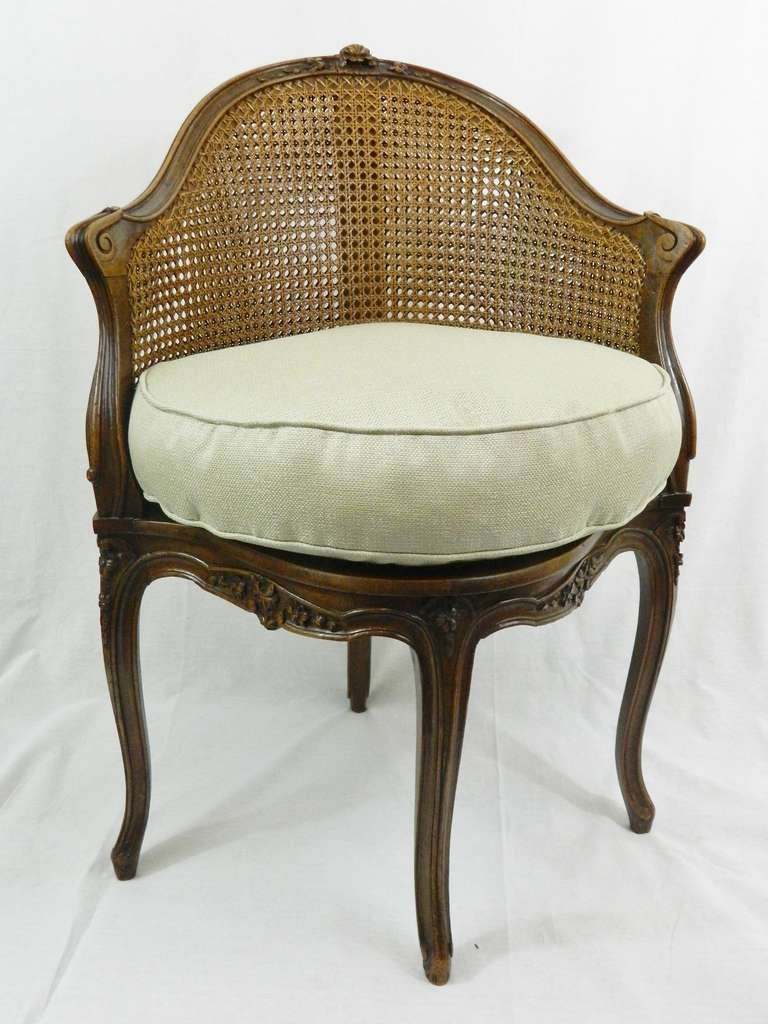 Early 20th Century Louis XV Style Walnut Hand Carved Caned Corner Chair or Fauteuil de Bureau with Custom Made Down Seat.  Lyrical shape with graceful arms - the chair back and shaped seat with caning