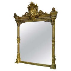 Circa 1870 Large Victorian Giltwood Overmantel Mirror Adorned with a Large Shell
