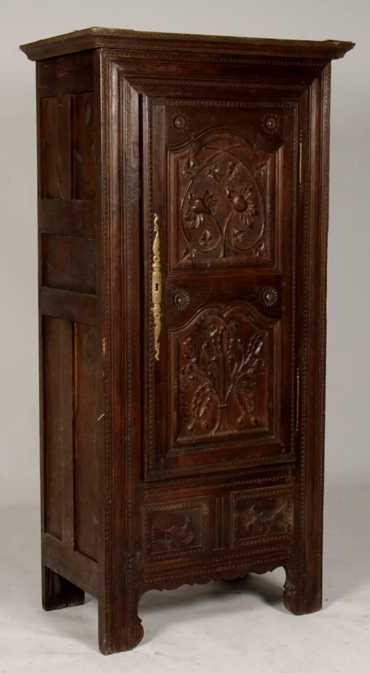 A French Oak Bonnetiere with Carved Door, Early 19th Century 1