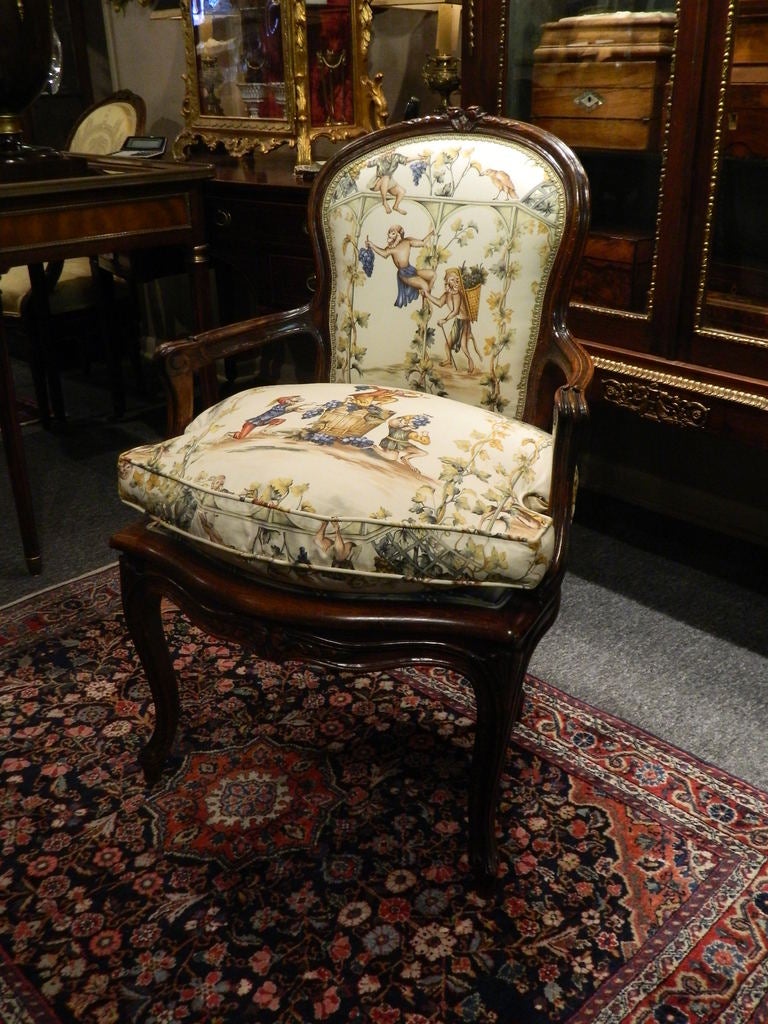 Circa 1840's French Carved Walnut Fauteuil Chair with Down Seat.  Newly Upholstered in a Beautiful Monkey Scene Cotton Fabric with a Silk Fabric on Back and Seat