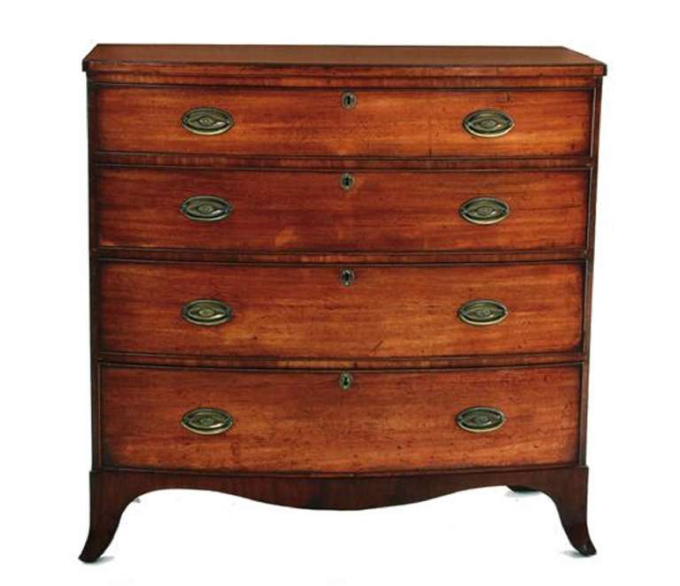 Georgian style mahogany bow front chest of drawers, molded edge top over four long graduated drawers, on splayed feet, circa 1840.