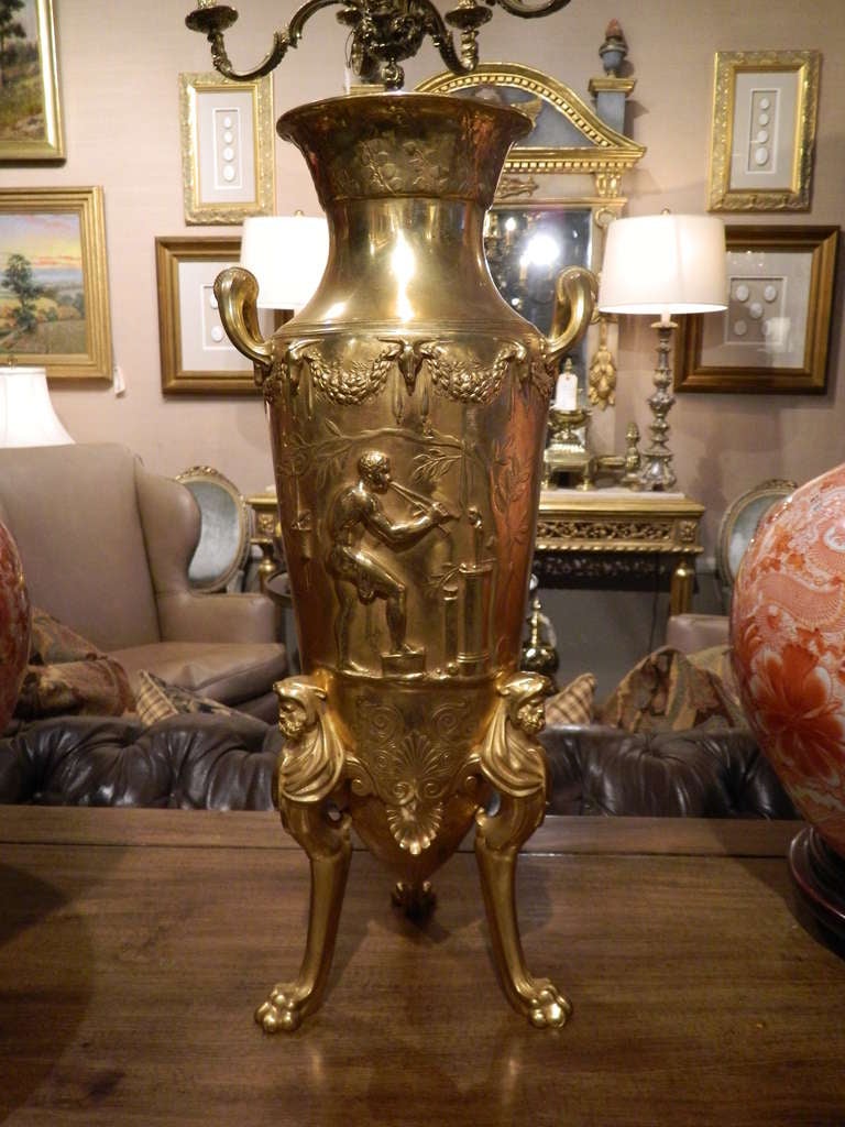 19th century neoclassical signed bronze doré urn with handles and adorned with elaborate roman scenes. Signed stamped F. Levillain. Ferdinand Levillain (Paris, 1837-1905) studied under the sculptor Jouffroy (1806-1882), before making his debut in