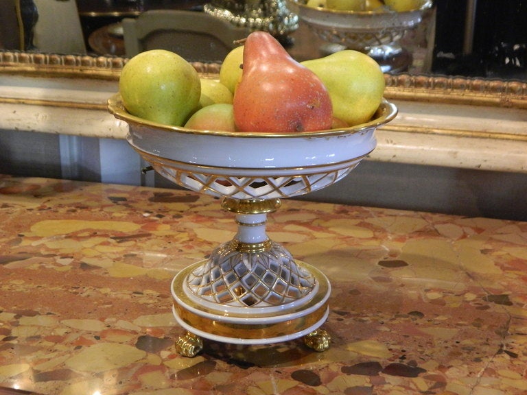 Old Paris Style Porcelain Reticulated Compote with Gold Detailing.  The large basket is supported by a reticulated base and sits on three gilded paw feet