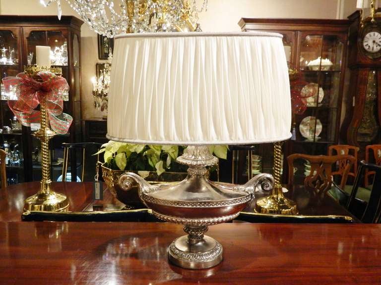 Circa 1920's silver lamp with a custom silk shade.