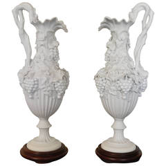 Pair of White Bisque Porcelain Urns with Handles and Fruit Relief, Circa 1920's