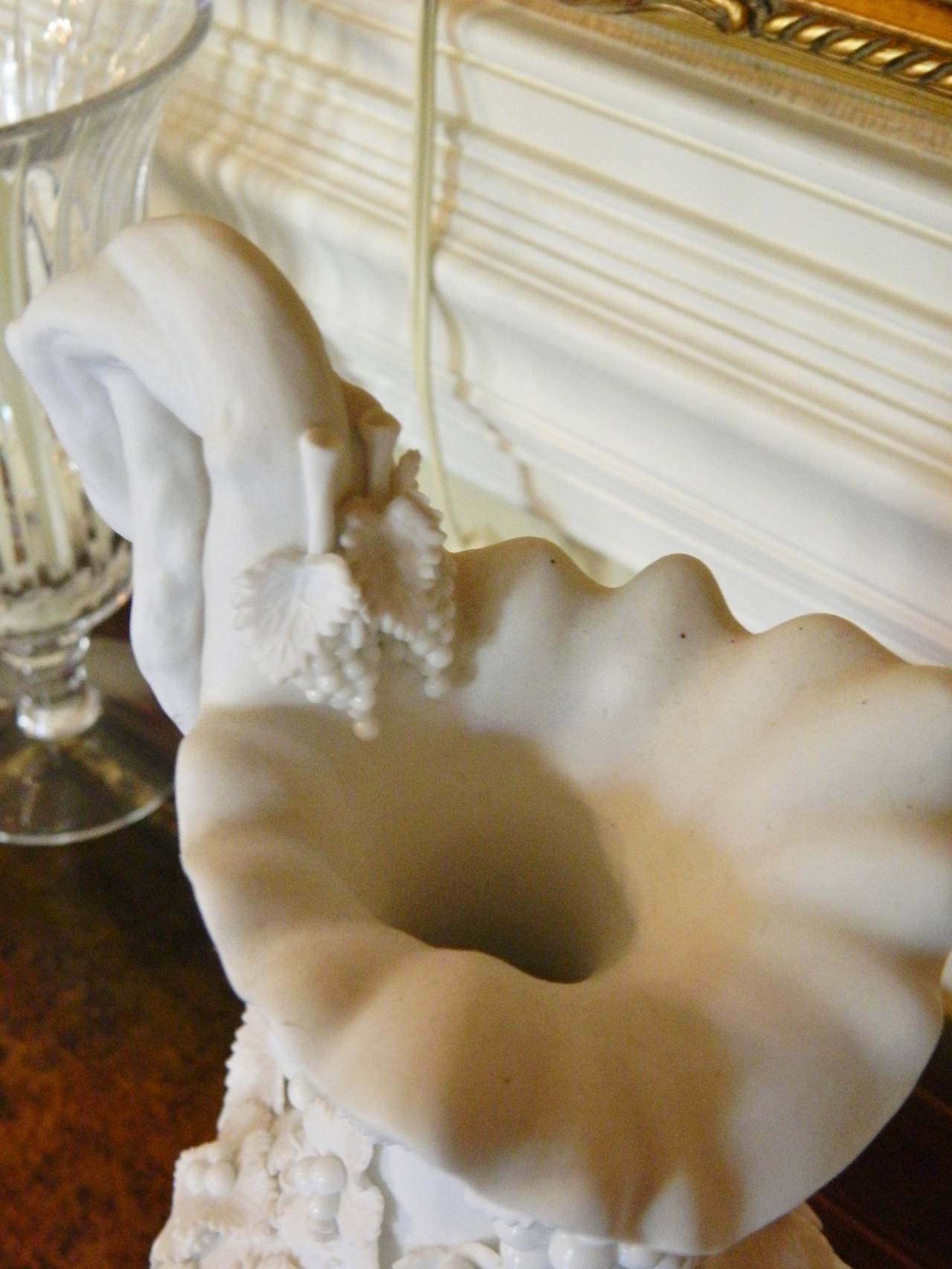 Pair of White Bisque Porcelain Urns with Handles and Fruit Relief