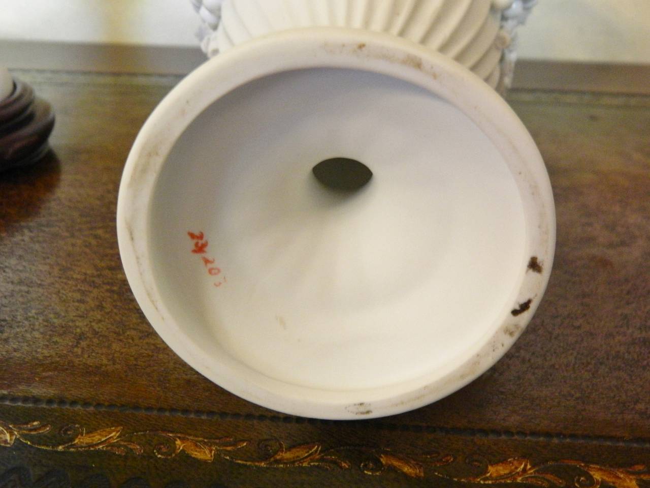 Pair of White Bisque Porcelain Urns with Handles and Fruit Relief