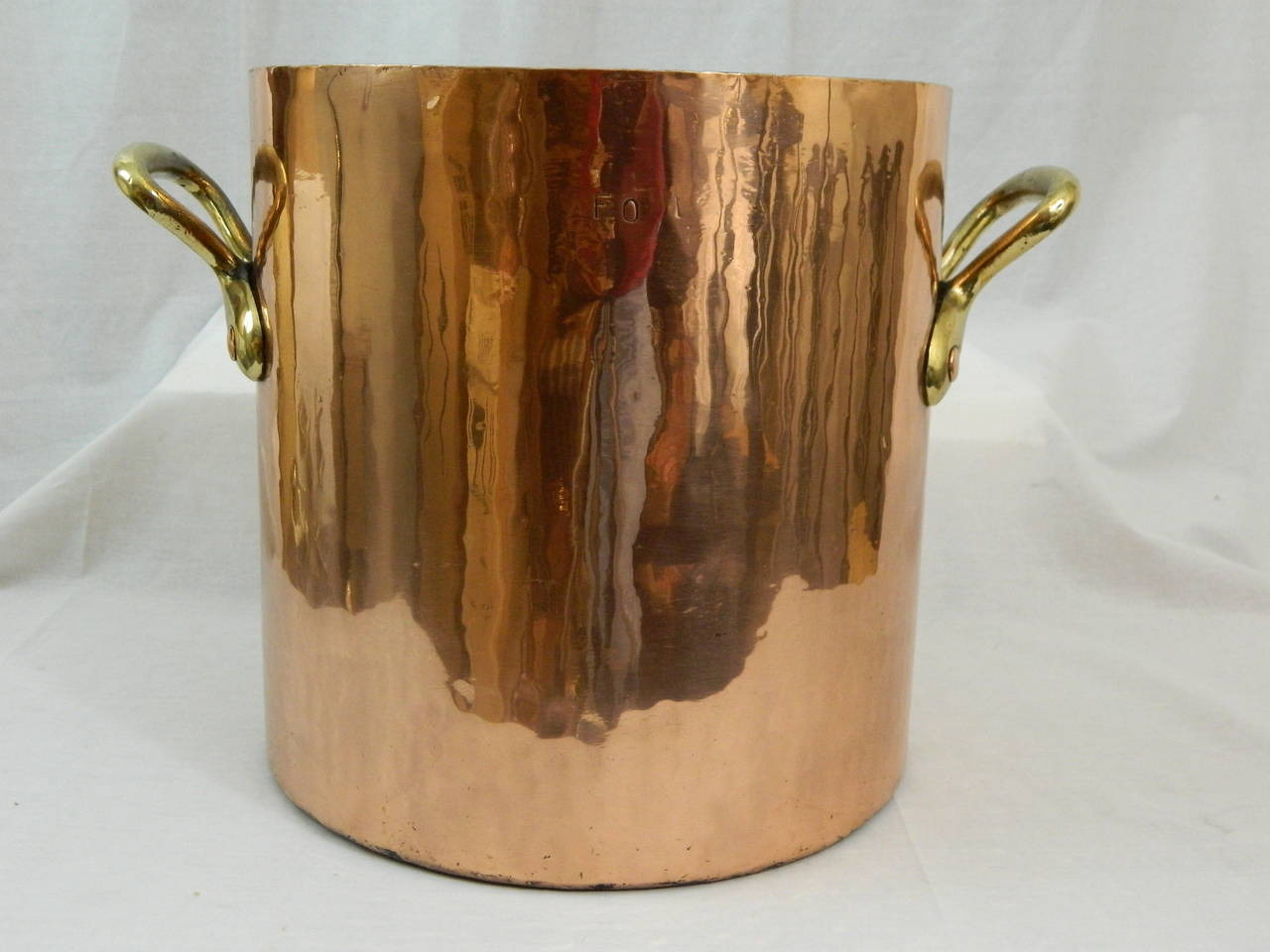 19th Century large copper stock pot with brass handles.  Professionally cleaned and polished.  32 quart