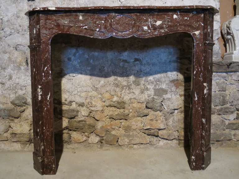 Beautiful Bordeaux/red/dark orange marble French Louis XV style fireplace from Paris, France, 19th century.
Firebox: Width 34.3 inches x high 33.5 inches.
   
 