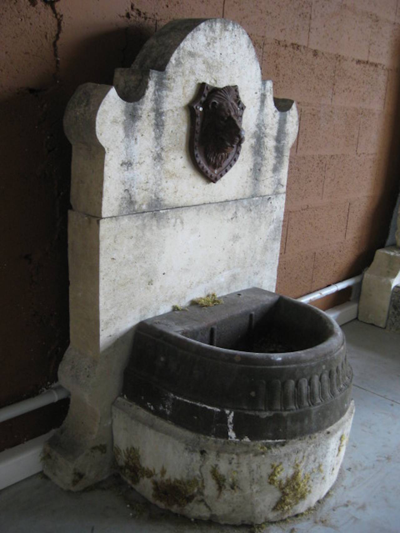 A French antique limestone and iron fountain from south of France, Provence area (Riviera Coast).

Beautiful lion's head where the water comes up.
Original basin. Val d Osne style foundry mid-19th century.

Limestone handcrafted in that period,