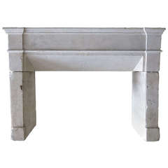French Louis XIII Style Fireplace in Limestone, Late 18th Century France