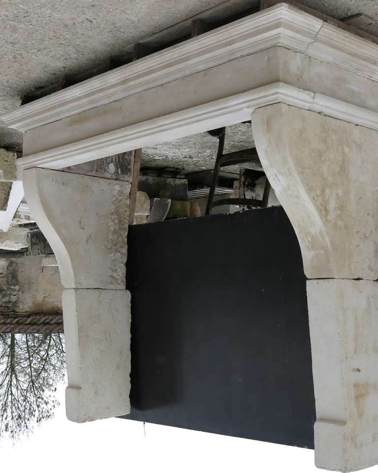 A French Louis XIII fireplace in limestone handcrafted circa 1800s in Lorraine, North East of France. Possibility to use it as a Kitchen Chimney Hood (very wild).

Firebox Dimensions:
Width 66.9 inches (170cm) x High 59.9 inches (152cm) 
x Depth