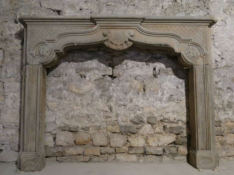 A rare Chateau-Quality Louis XIV style fireplace (Napoleon III) hand carved in Sandstone circa 1850s from France. Original and authentic.
Honeycomb, Pampilles and Scolls sculptures handcrafted from that period (1850s) all-over the mantel. Great