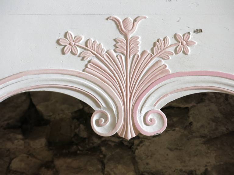 A French antique wood fireplace handcrafted circa 1880s from Paris, France.
It has been repainted in white and pink color. It was used and displayed in a lady's bedroom.
It is in a great condition and only in one part, very easy to install and