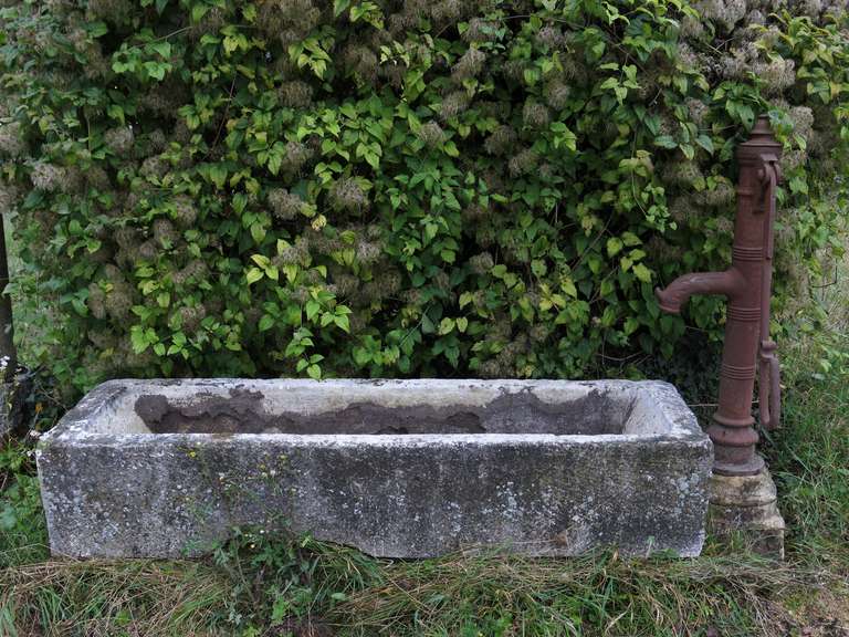 Village (countryside) water pump fountain in iron and limestone.
Originally used to provide water to horses.

 