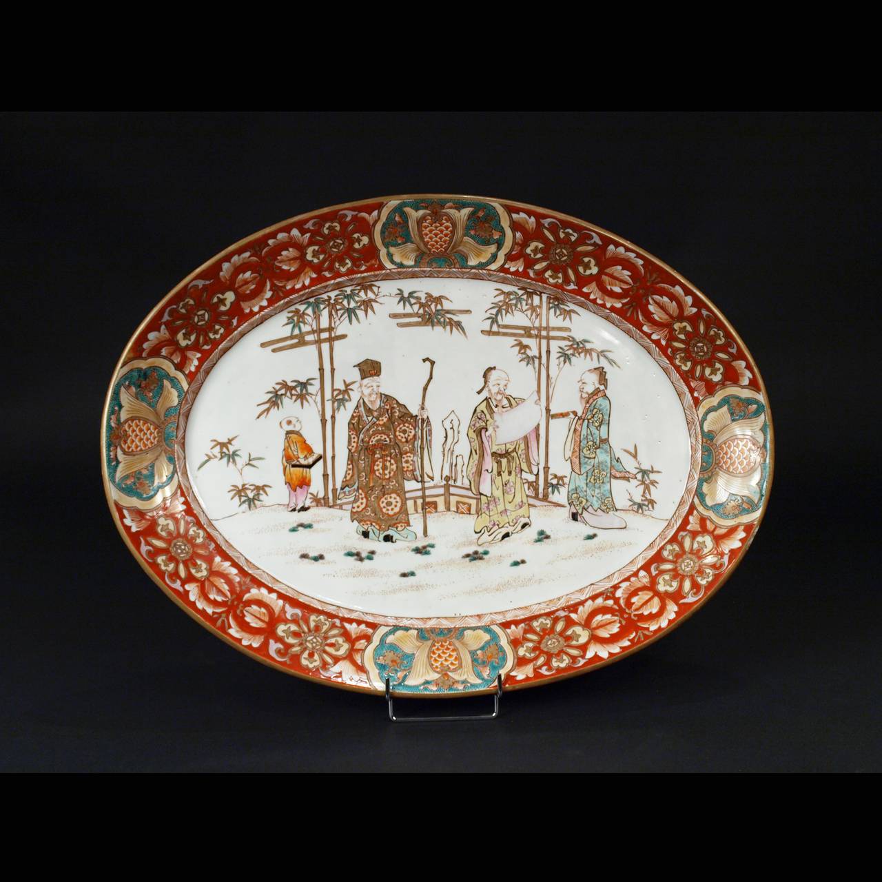 This pair of large porcelain chargers have a bright polychrome decoration of Wise men in gardens.
Different borders but with the same color.
Oval shape and size quite unusual.
Japan, Kutani, Meiji period, circa 1880-1900.