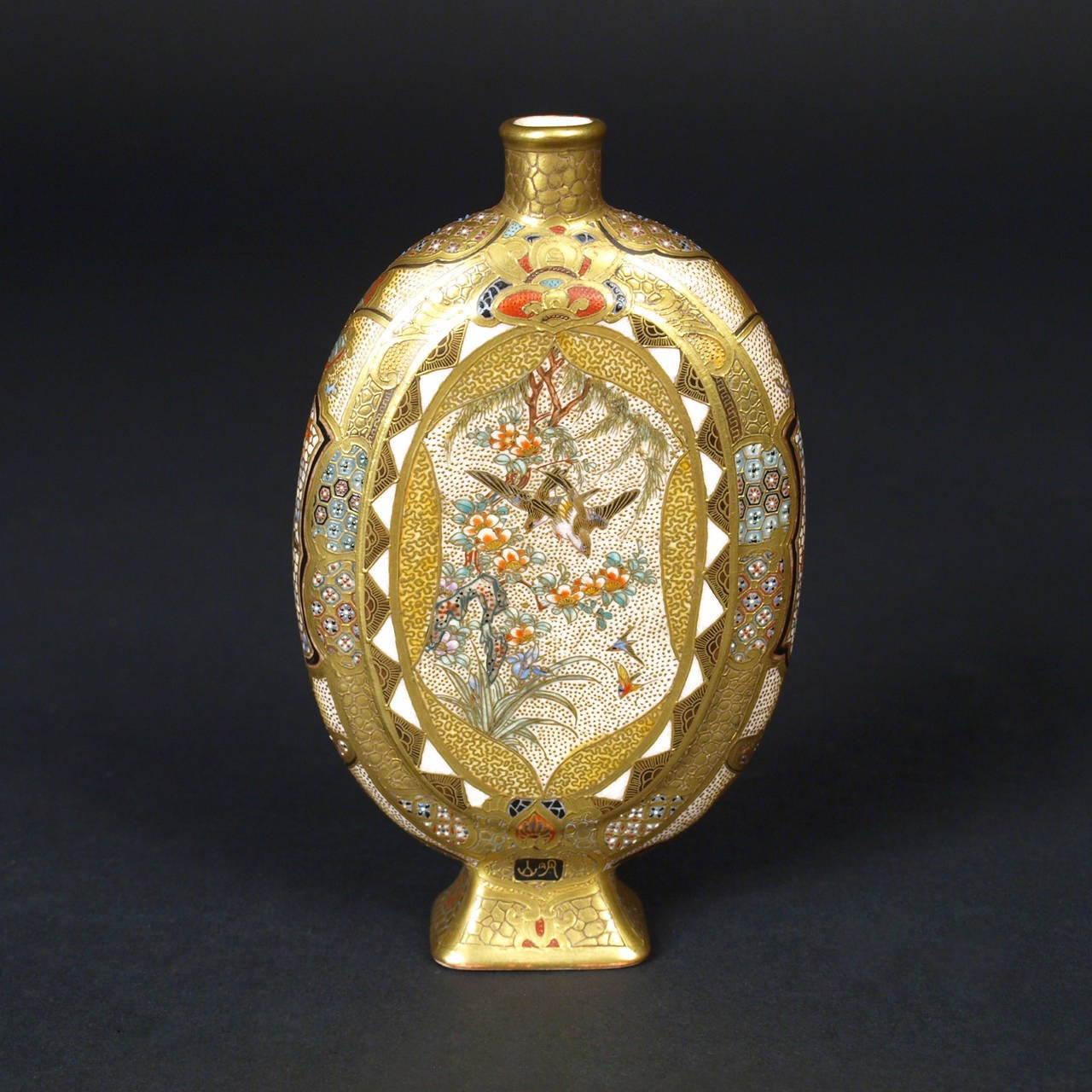 A fine pair of miniature Satsuma vases.
Signed Meizan, Meiji period (late 19th century).

The oval moon flask set on a splayed rectangular foot and painted in polychrome enamels and gilt on a clear, crackled ground with oval panels containing a