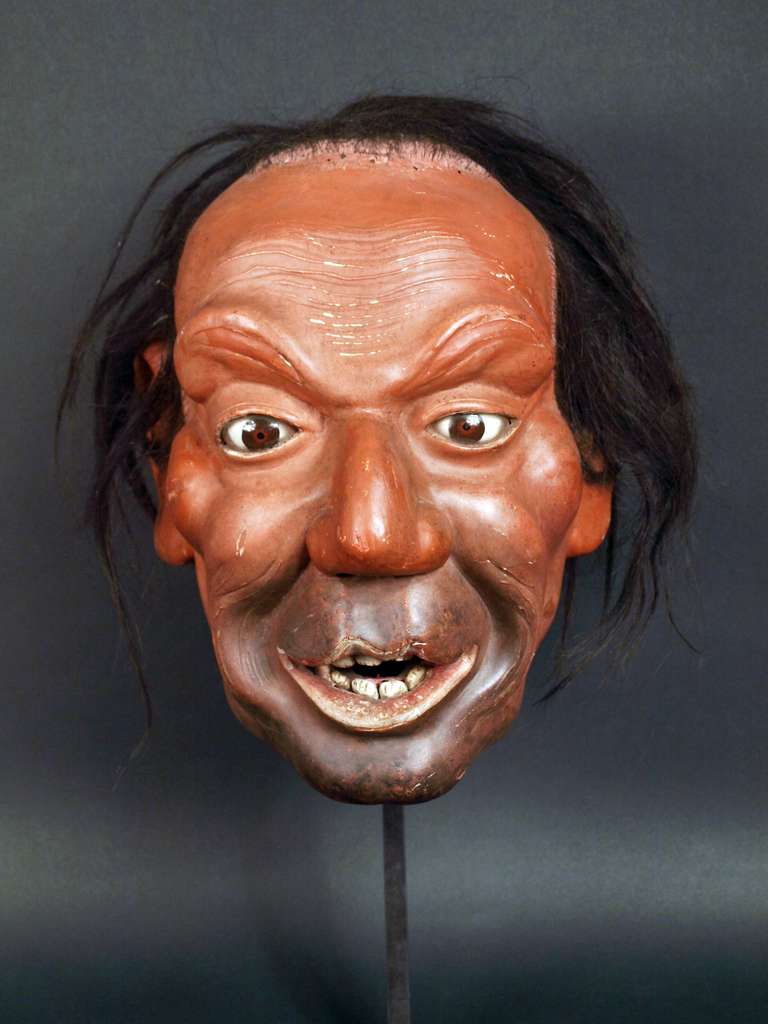 Meiji Period. Iki Ningyo mask in the shape of a man's head. Lacquer on wood with glass eyes and bone teeth. Iki Ningyo, living dolls, were very popular in the Meiji era. They were used in festivals for historical revivals. Sculptors as Akiyama