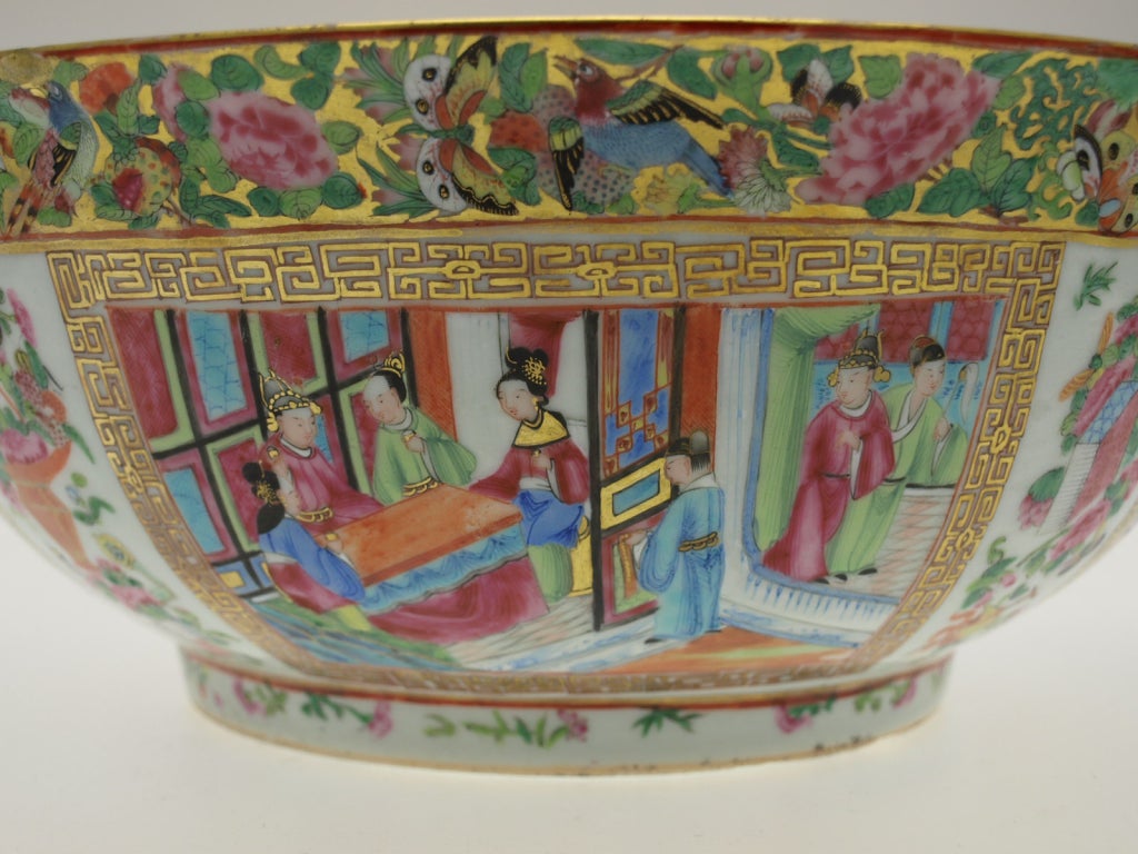 Beautiful Cantonese punch bowl decorated inside and outside with figures in palaces and gardens.  Ground with green scrolls on gold with flowers and butterflies.  Daoguang period circa 1840-1850.

size is 33.5 cm x 14 cm