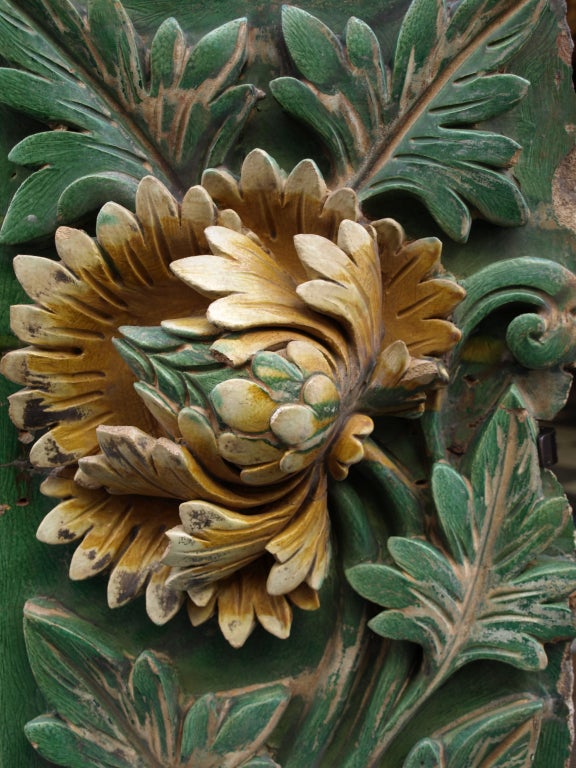 This decorative green and yellow glazed terracota wall element represents a large peony in high relief. During the Ming period, this architectural element decorated a garden wall  in a healthy person house as decorations for more ordinary poeple had