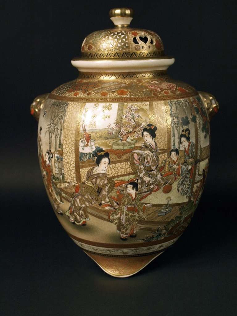 A Japanese Satsuma earthenware Koro and cover by Hozan, Meiji period, the globular body painted and gilt with panels of figures and flowers, reserved against a simulated brocade and flower ground, gilt signature HOZAN to base.