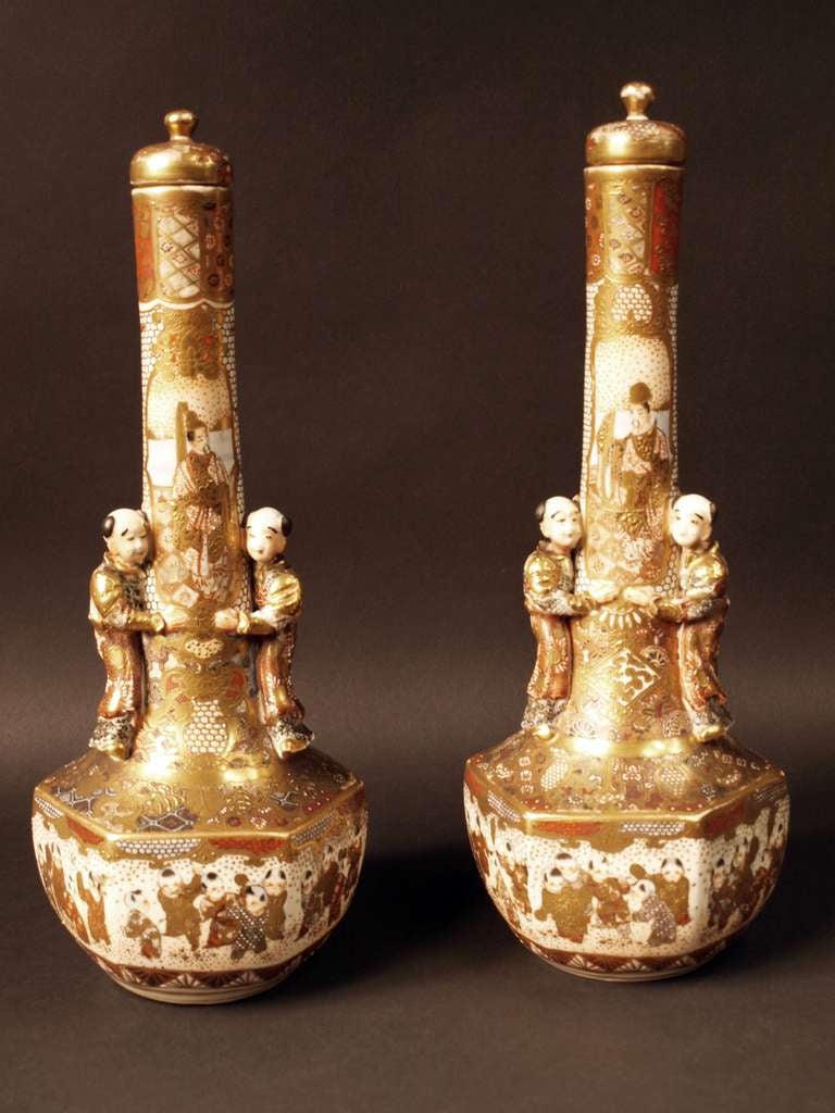 A very nice pair of Satsuma covered vases decorated with boys.
the base of the vases is decorated with children playing.