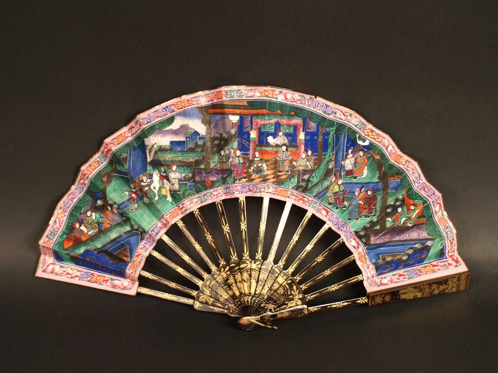 A Canton telescopic fan, Fan in which the sticks slide into the ribs to make the fan smaller to carry, painted recto and verso Chinese export Cantonese telescopic fan, with figures on terraces, their faces of ivory, their clothes of silk, with