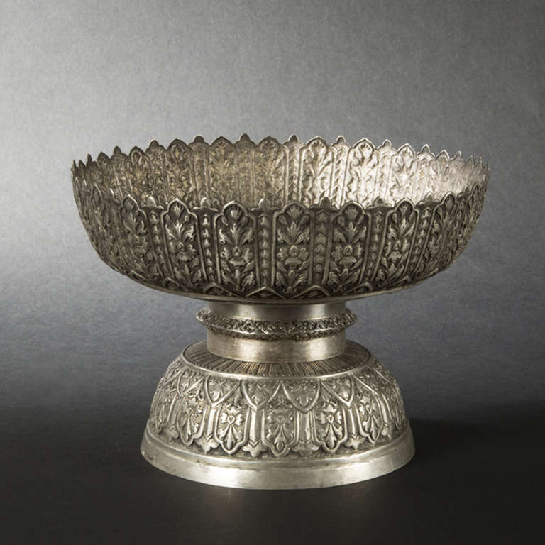 This lotus form sterling silver presentation bowl has been brought from Indochina by a French family. It has been hand made at the end of the 19th century and is probably comming from Cambodia.
it seems to have some makers marks under.

French