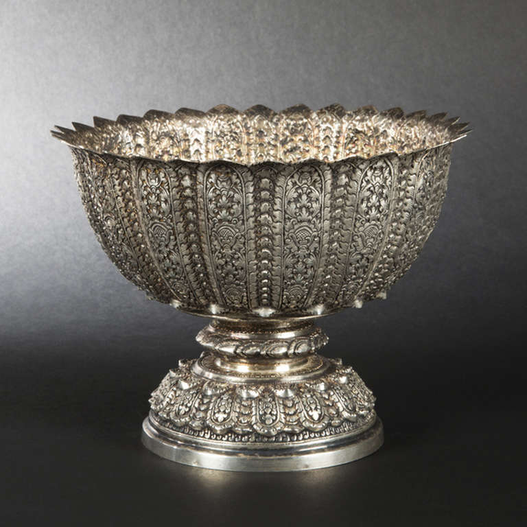 This lotus form sterling silver presentation bowl has been brought from Indochina by a French family. It has been hand made at the end of the 19th century and is  comming from Cambodia.

French hallmark for imported sterling silver.

Height :