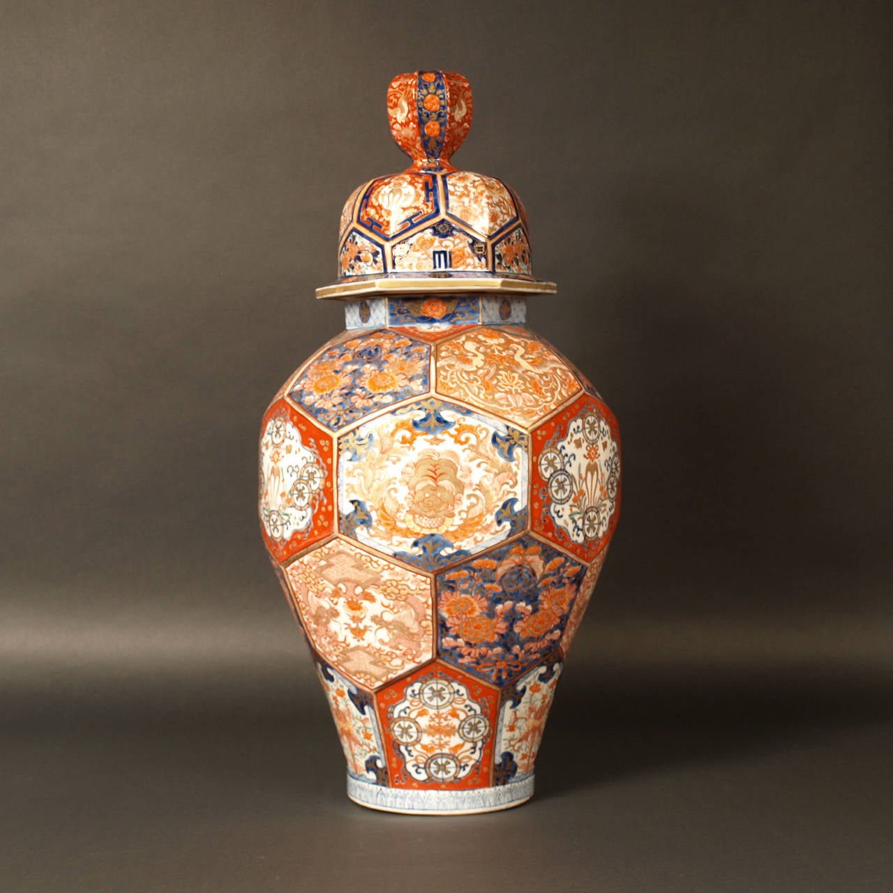 Highly decorative large covered vase. 
Arita porcelain hand-painted in the Imari pattern in cobalt blue, Iron red and gold.
68 cm high. Diameter is 35 cm.

Japan, mid-19th century.