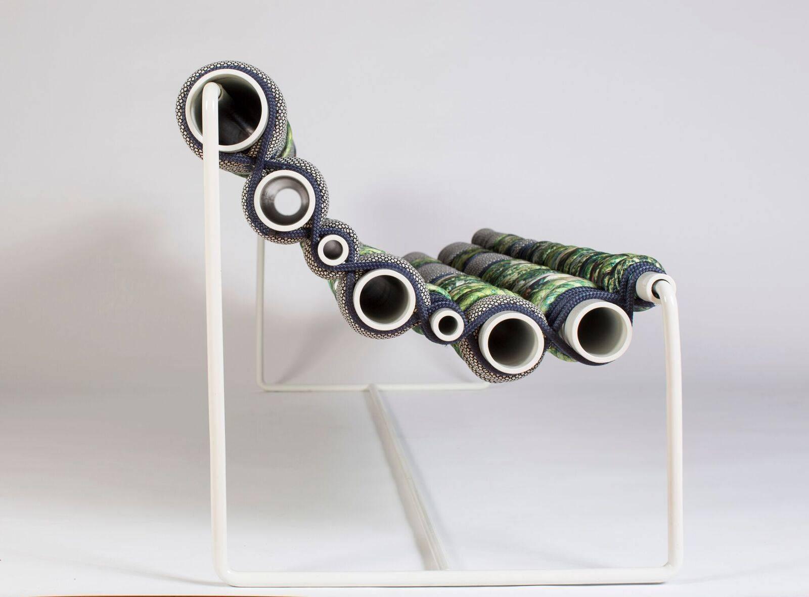 This Betil Dagdelen alloy bench is made with powder-coated aluminum pipes, steel, marine rope and upholstery fabric in 2016. 

Betil Dagdelen was born in Izmir, Turkey in 1978. She studied political science and international relations at Koç