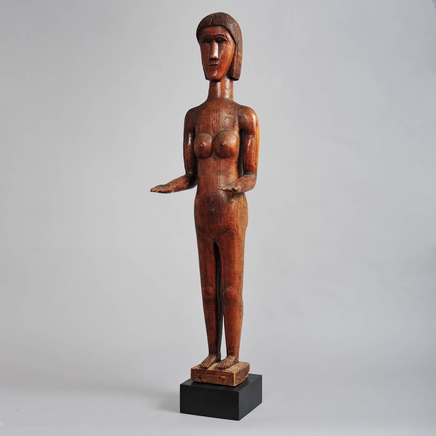 This rare carved figure of a woman made of yellow pine, determined through micro-analysis, was originally found in coastal Georgia and thought to be carved by an African-American living on one of the barrier islands which were largely occupied by