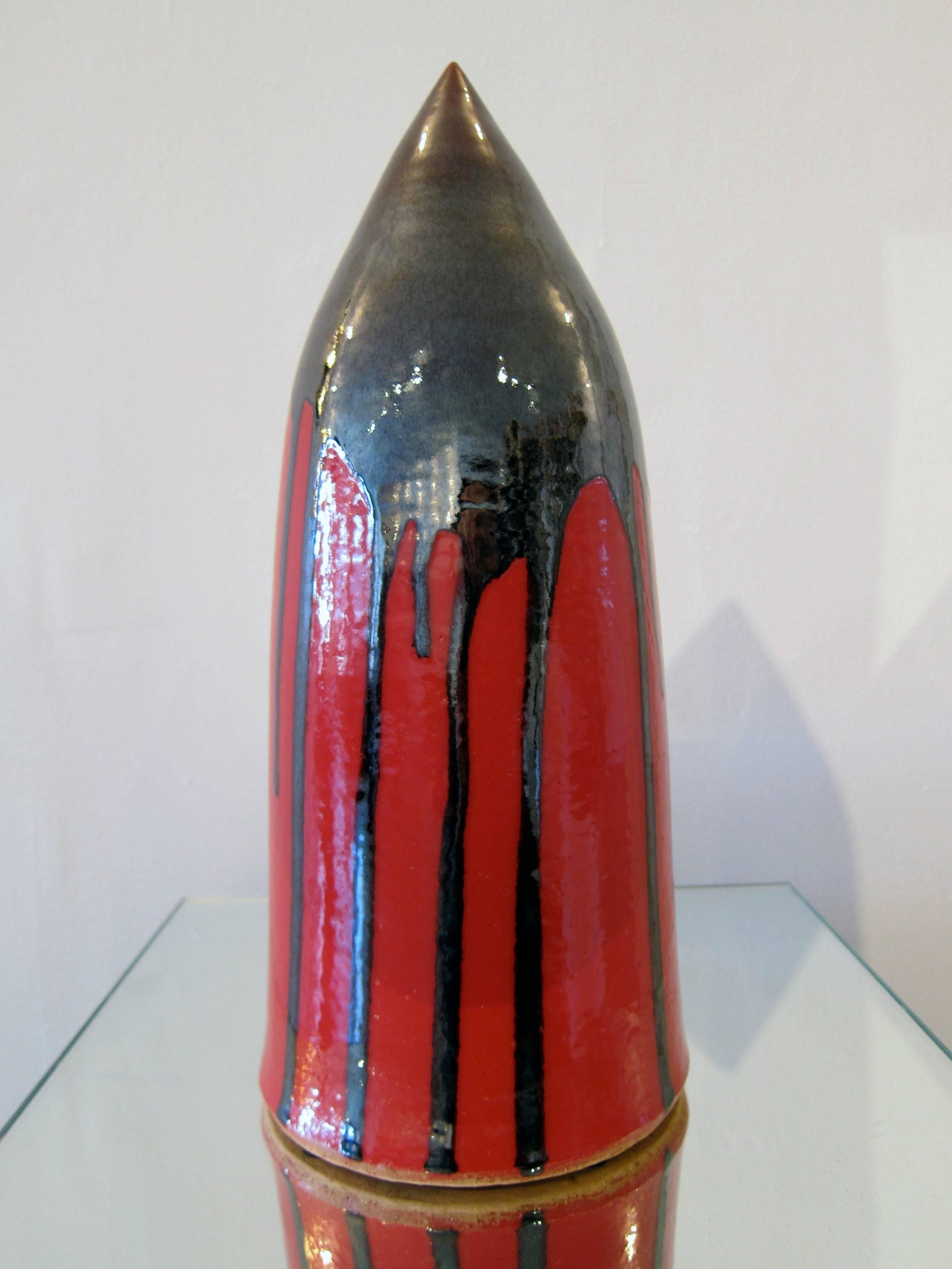 This red and black sculpture made of high fire stoneware and glaze from 2013 is the work of sculptor James Salaiz.

James Salaiz is a sculptor and ceramicist based in New York City. His first experience with clay was as a young child in San Antonio,