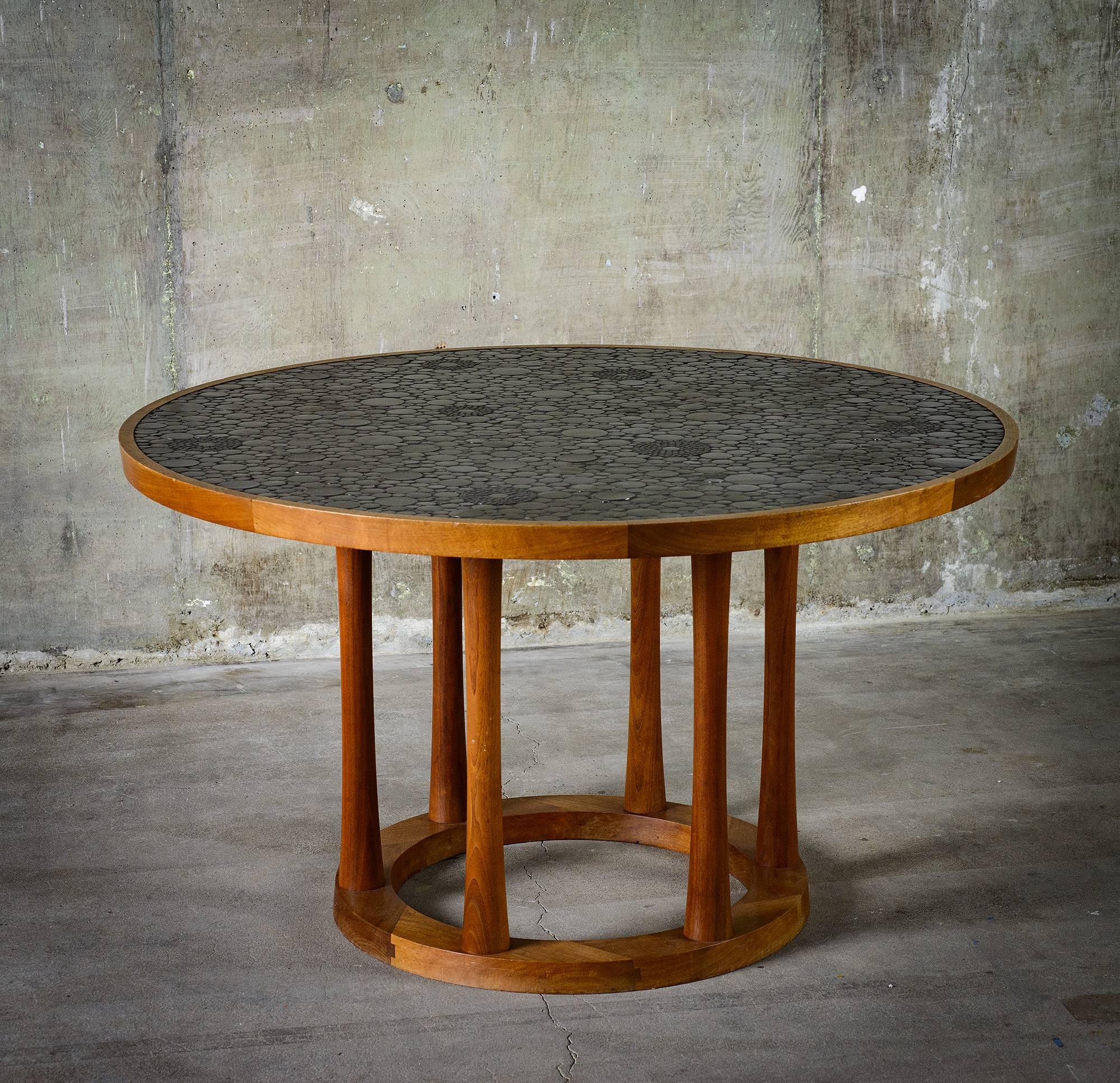 From Gordon and Jane Marshall Martz, for Marshall Studios, this dining table is made with round black glazed tiles and walnut. The piece is made in the USA at Veedersburg, Indiana, circa 1960s.

Good condition with minor scratches on base.
  