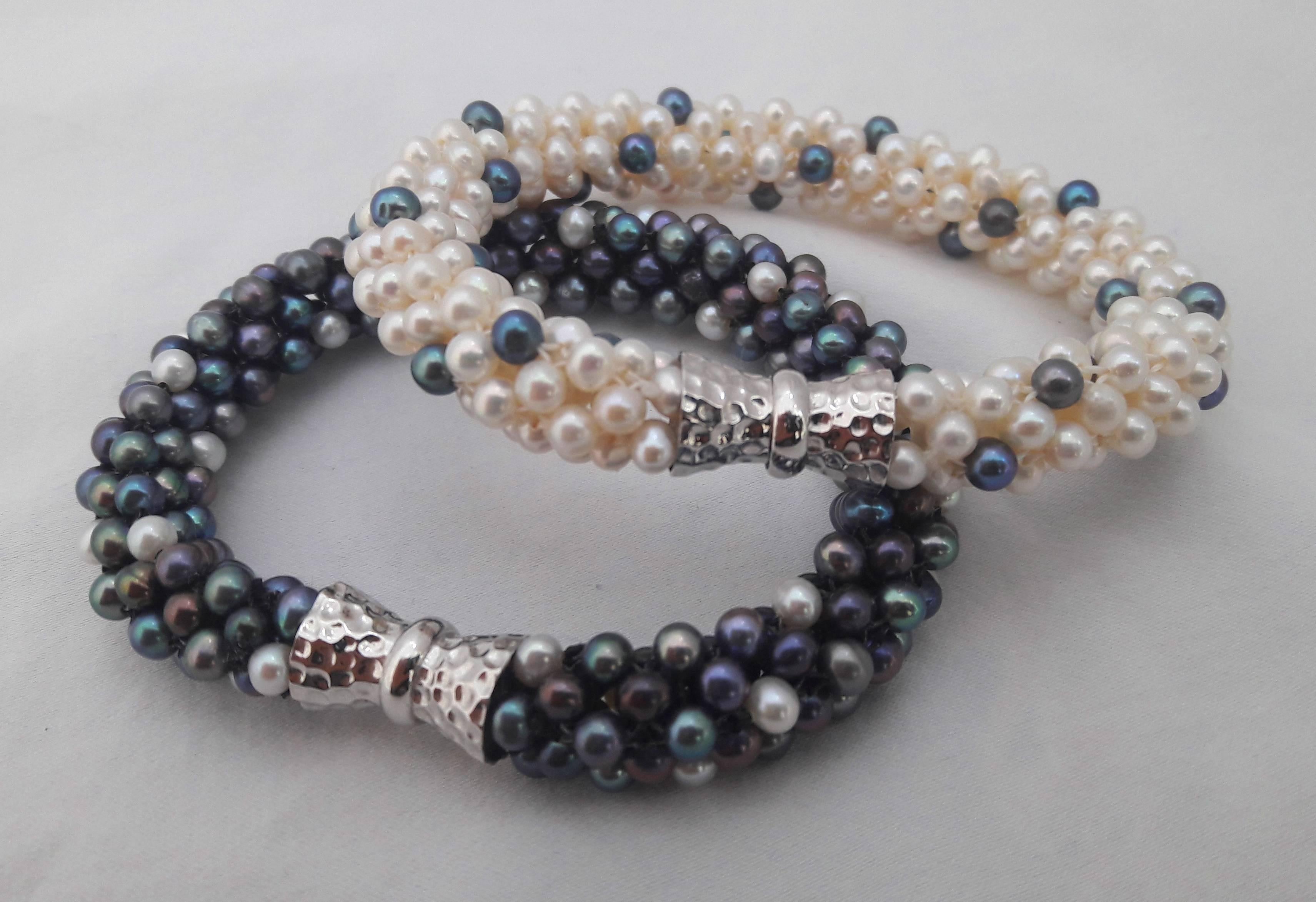 White pearl and black pearl are woven together to create a rope style necklace. Beads measure 3.5mm each and woven into a thick tubular rope of approximately 1/3 of an inch. This unique, modern and one of a kind necklace can be worn day or night.