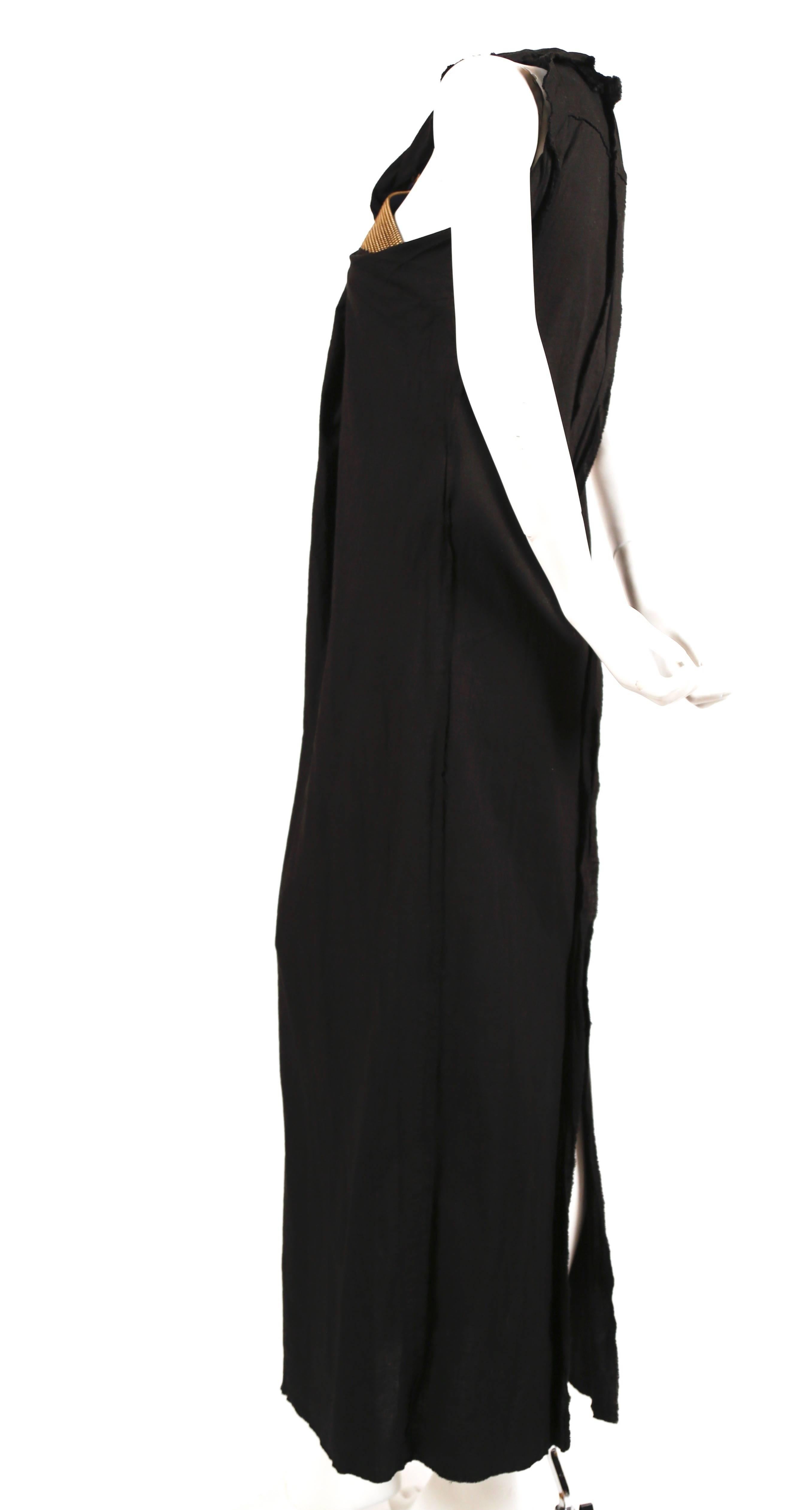 Black cotton muslin long dress with raw edges and unique layered brass zipper trim by Junya Watanabe for Comme Des Garcons exactly as seen on the spring 2005 runway. Size S. Approximate measurements: bust 34